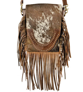 Brown and White Cowhide Crossbody Bag with flap and brown suede fringe